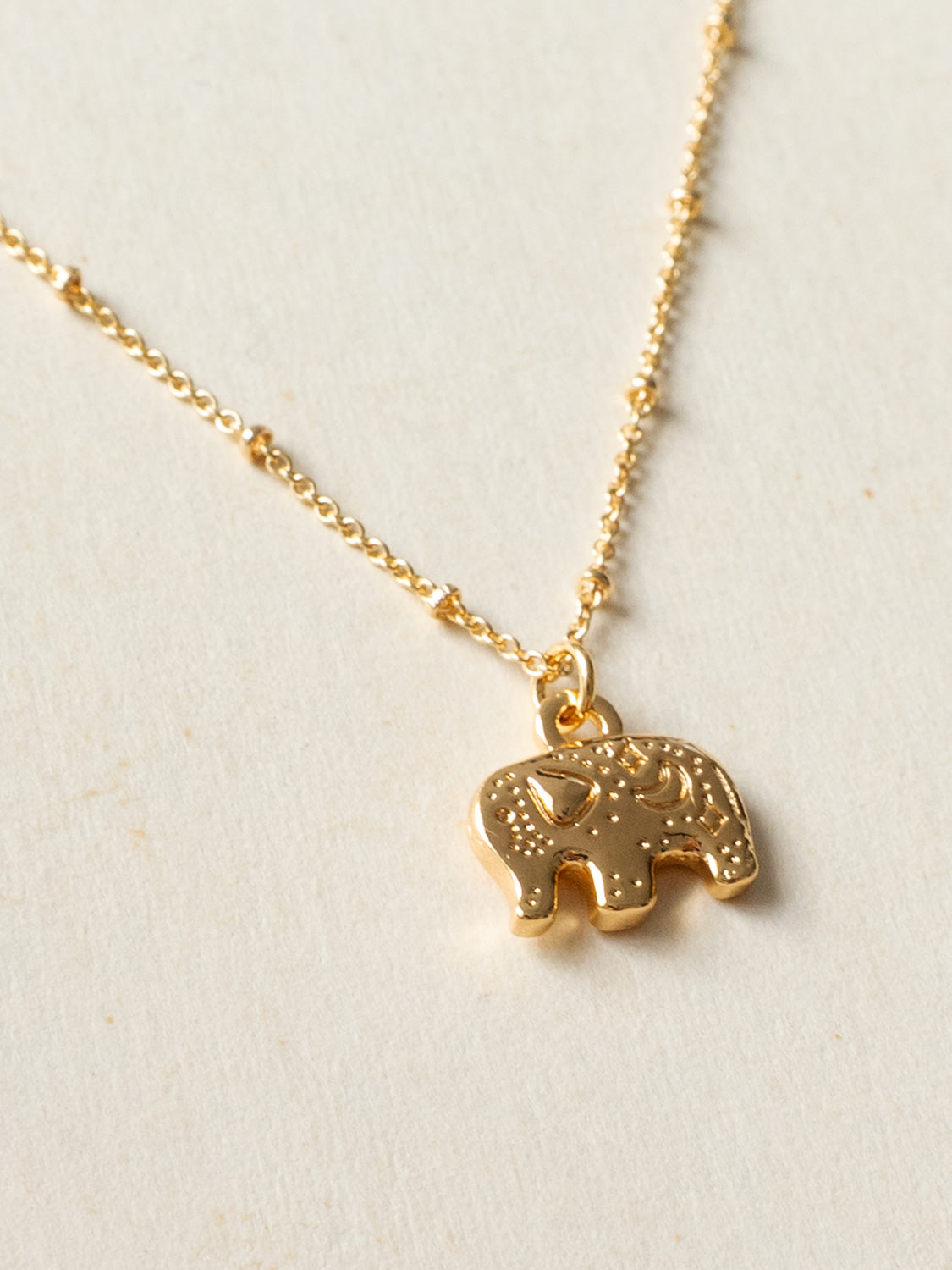 Resort Necklace, Gold - Carved Gentle Elephant