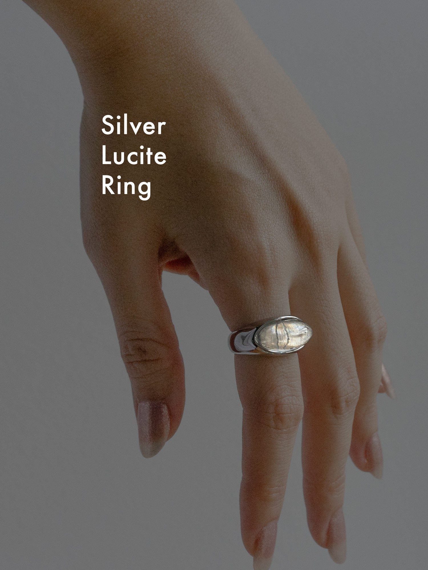 silver lucite ring text