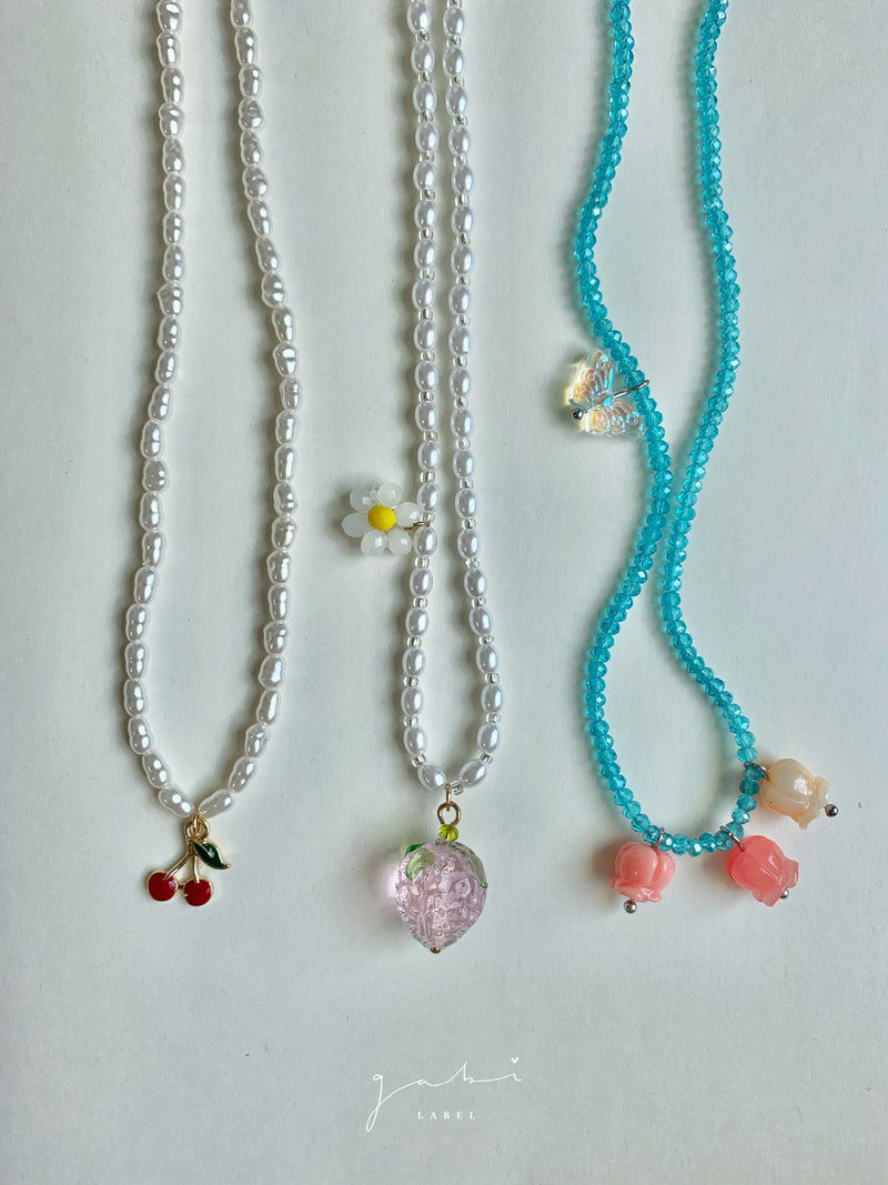 Dainty Blue Necklace with Assorted Charms